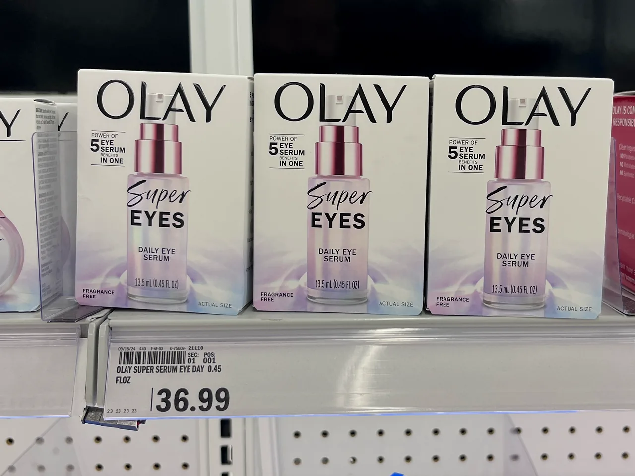 OLAY Super Eyes Daily Eye Serum displayed on a store shelf.