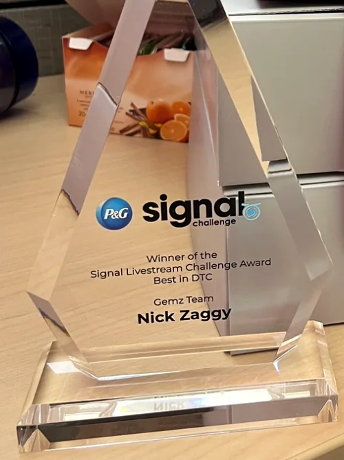 The P&G Signal Livestream Challenge award engraved Best in DTC, Gemz Team, Nick Zaggy.