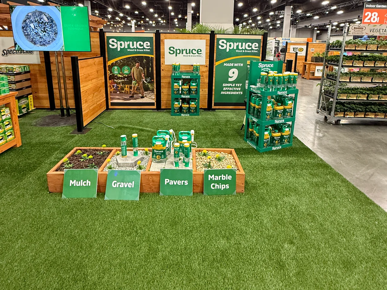 Spruce displays beside raised demonstration beds.